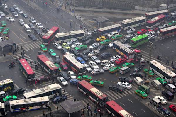 Vehicles are stuck in a traffic jam in heavy smog after the traffic lights were broken-down on February 25, 2014 in Xi an, China